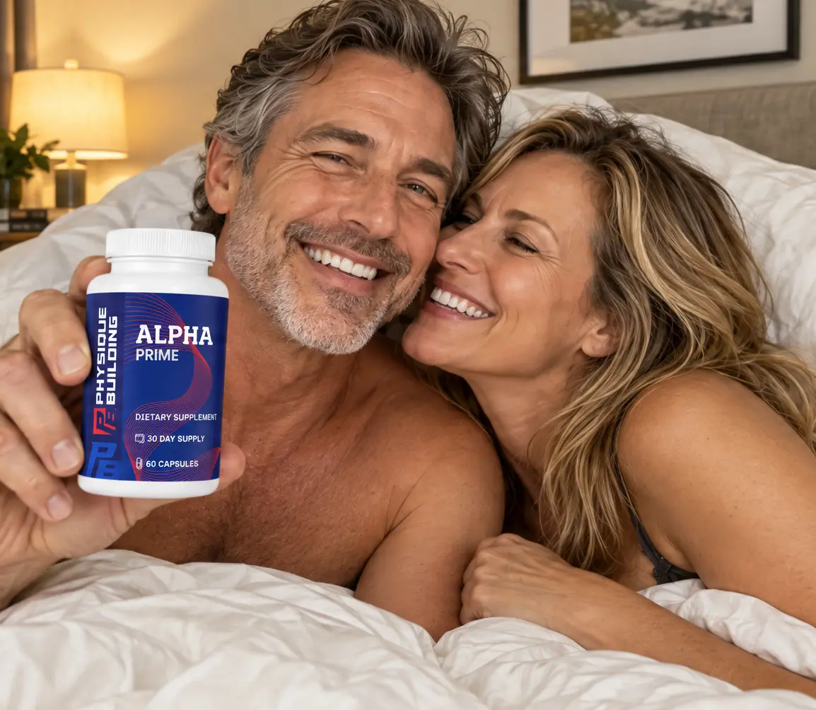 Couple relaxing in bed with the man holding a bottle of Alpha Prime